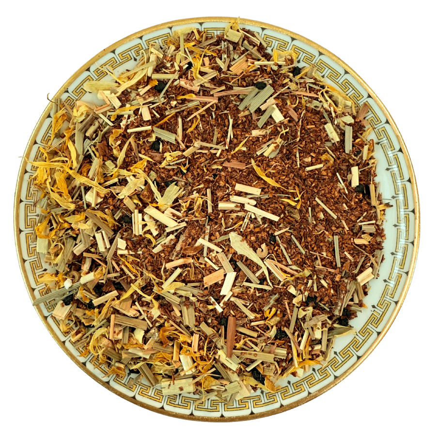 Dry herbs and spices on a decorative plate with a black background