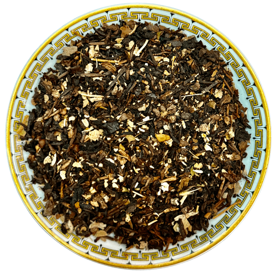 Tea leaves on a decorative ceramic plate with a white background