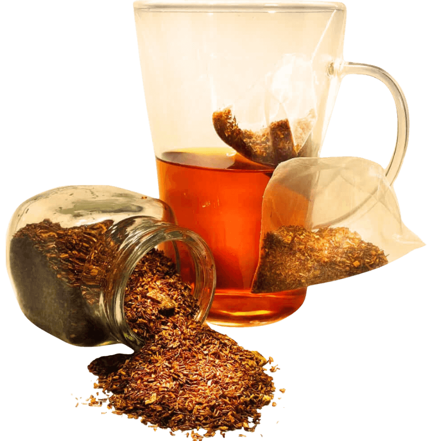 Glass teacup with tea bag and brewed tea, next to a jar of loose tea leaves on a white background