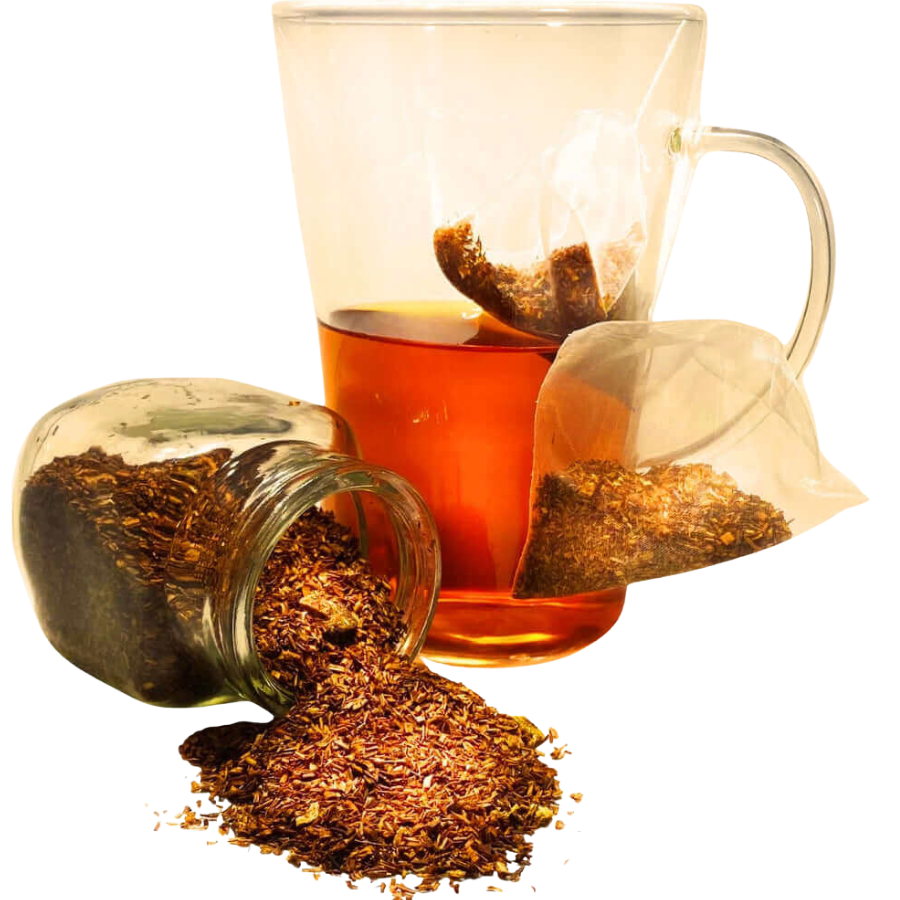 Glass teacup with tea bag and brewed tea, next to a jar of loose tea leaves on a white background