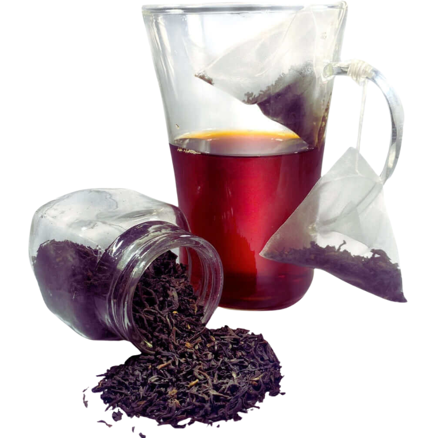 Tea leaves spilling out of a jar with a glass of tea and tea bags on a white background