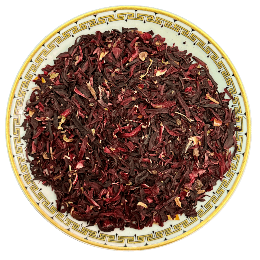 Dried hibiscus tea leaves on a decorative plate with a white background