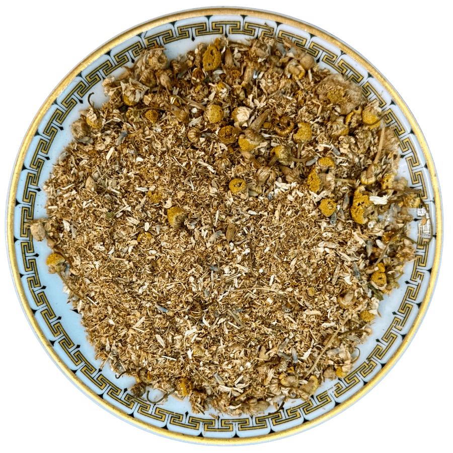 Hibiscus Citrus Delight Tea blend featuring dried herbs and flowers in a decorative dish, perfect for a hibiscus citrus drink recipe.