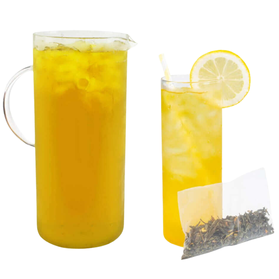 Pitcher and glass of lemonade with a lemon slice and tea bag on a white background