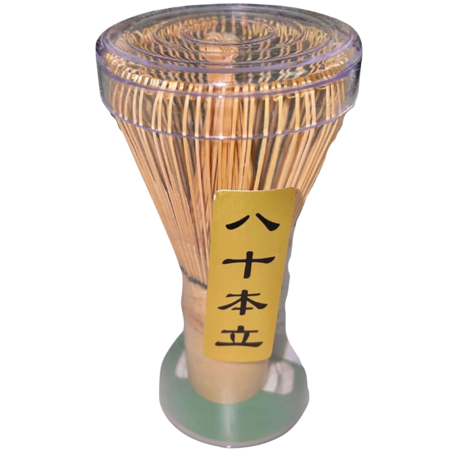 Bamboo matcha whisk with a clear plastic container on a white background