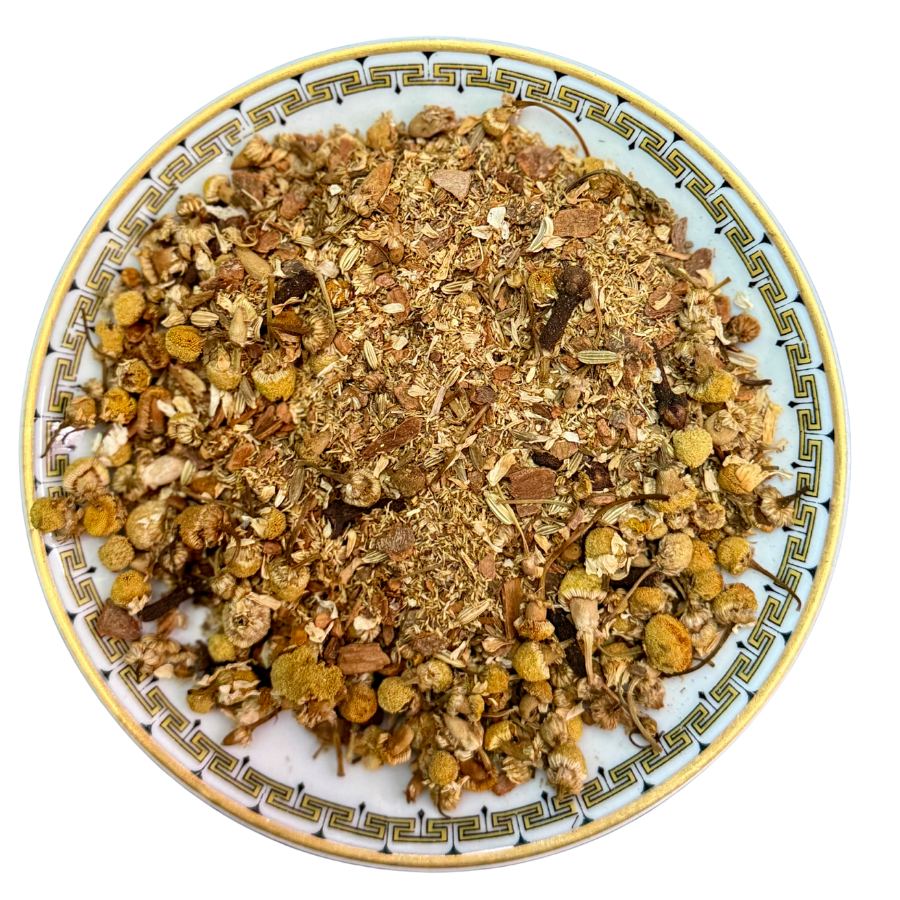 Herbal mix on a decorative plate with a white background