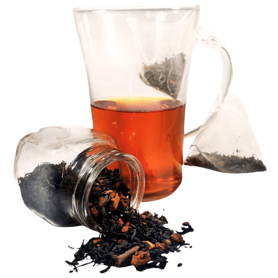 Glass teapot with tea leaves and a glass of black tea on a white background
