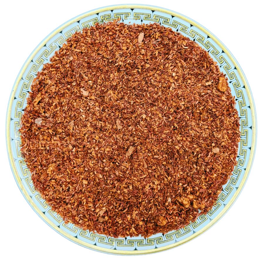 Dried herbs or spices on a decorative plate with a white background