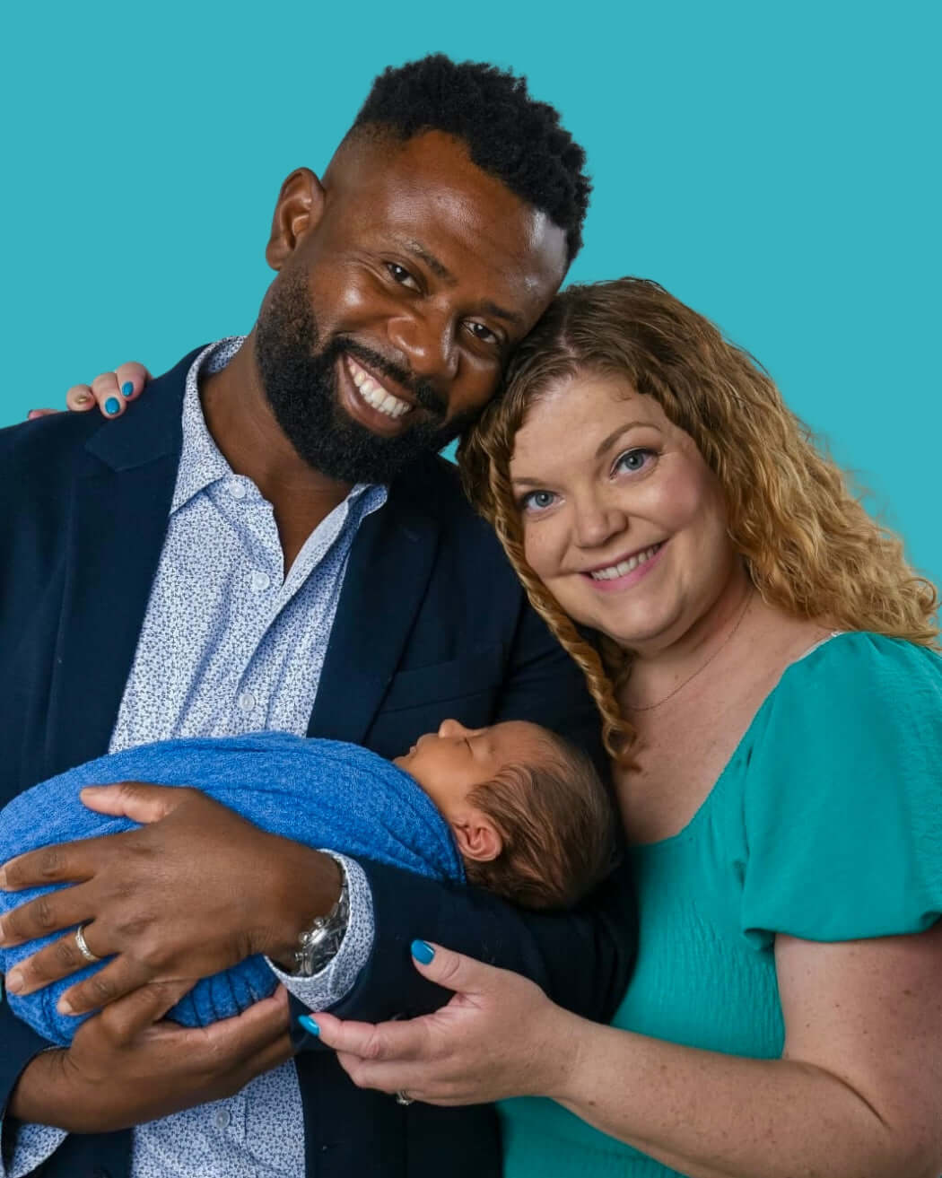 Joseph's Family of three with a baby against a teal background