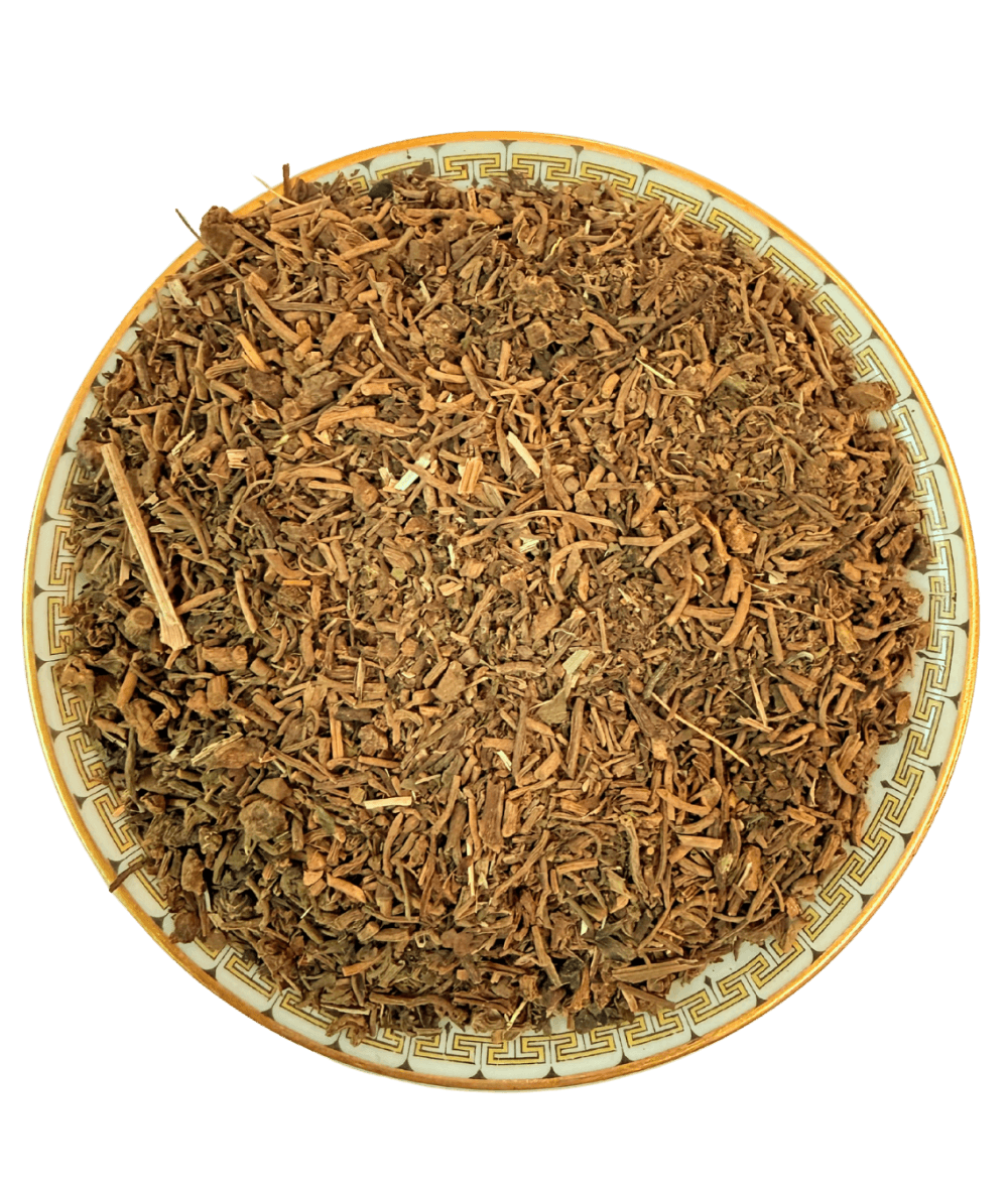 Dried herbs or spices in a decorative bowl on a white background