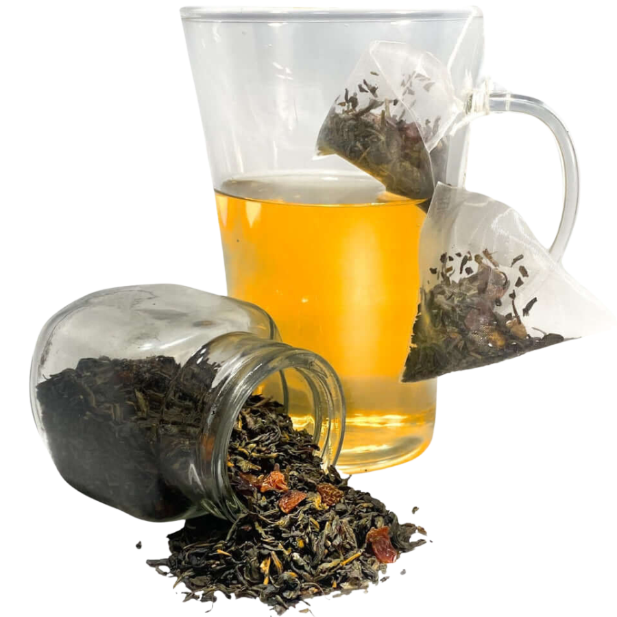 Glass mug with tea and tea bags, jar of loose tea on a white background