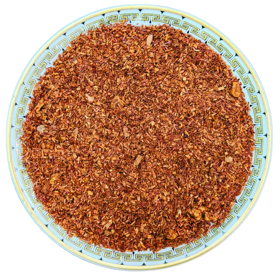 Dried herbs or spices on a decorative plate with a white background
