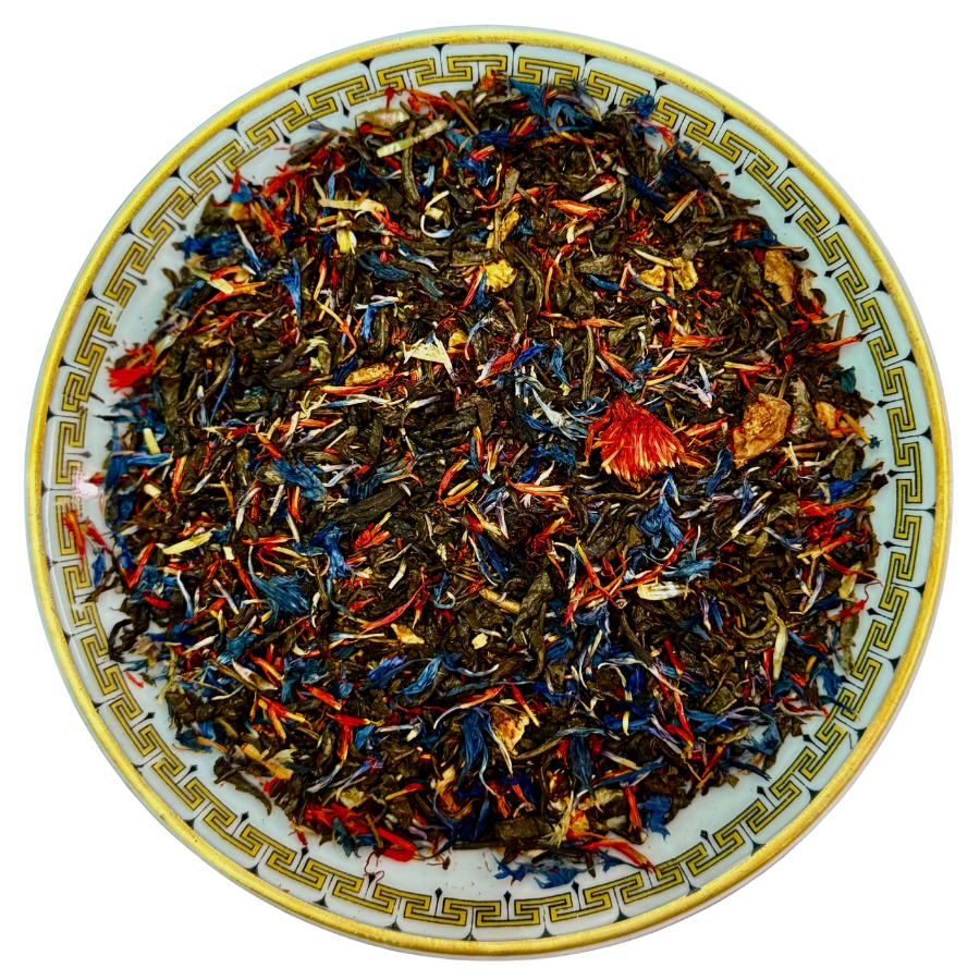 Colorful tea leaves on a decorative plate with a white background