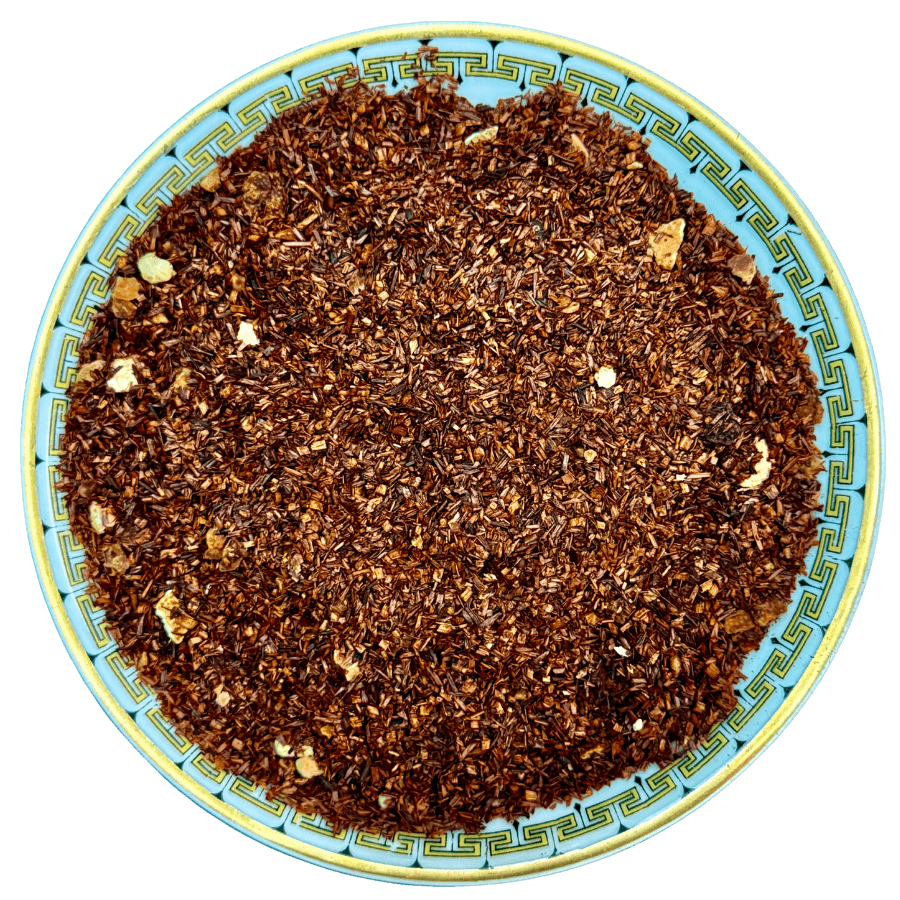 Roasted coffee beans on a decorative plate with a blue and yellow border