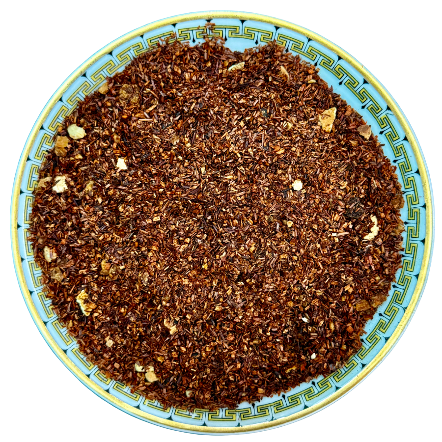Roasted coffee beans on a decorative plate with a blue and yellow border