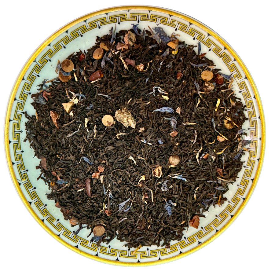 Tea leaves on a decorative plate with intricate patterns
