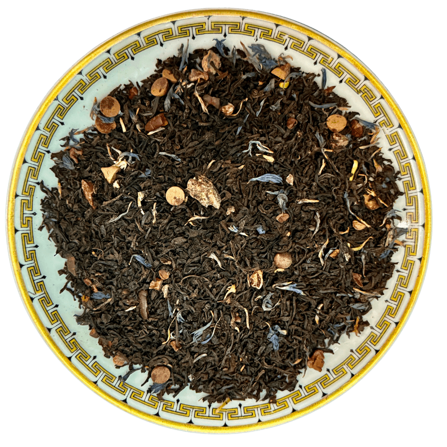 Tea leaves on a decorative plate with intricate patterns
