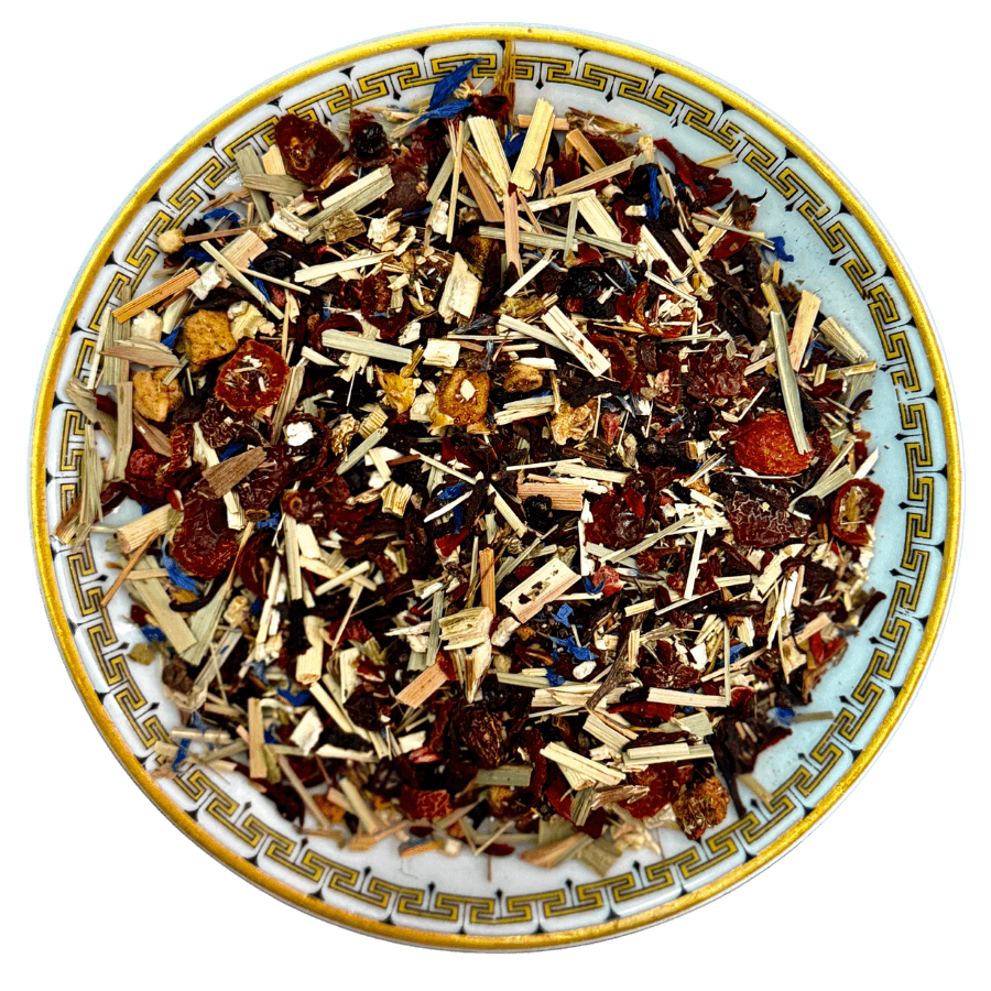 Assorted dried herbs and spices on a decorative ceramic plate