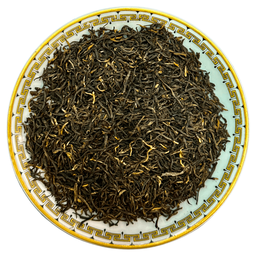 High-quality leaves of Decaf Breakfast Loose Leaf Tea presented in a decorative plate.