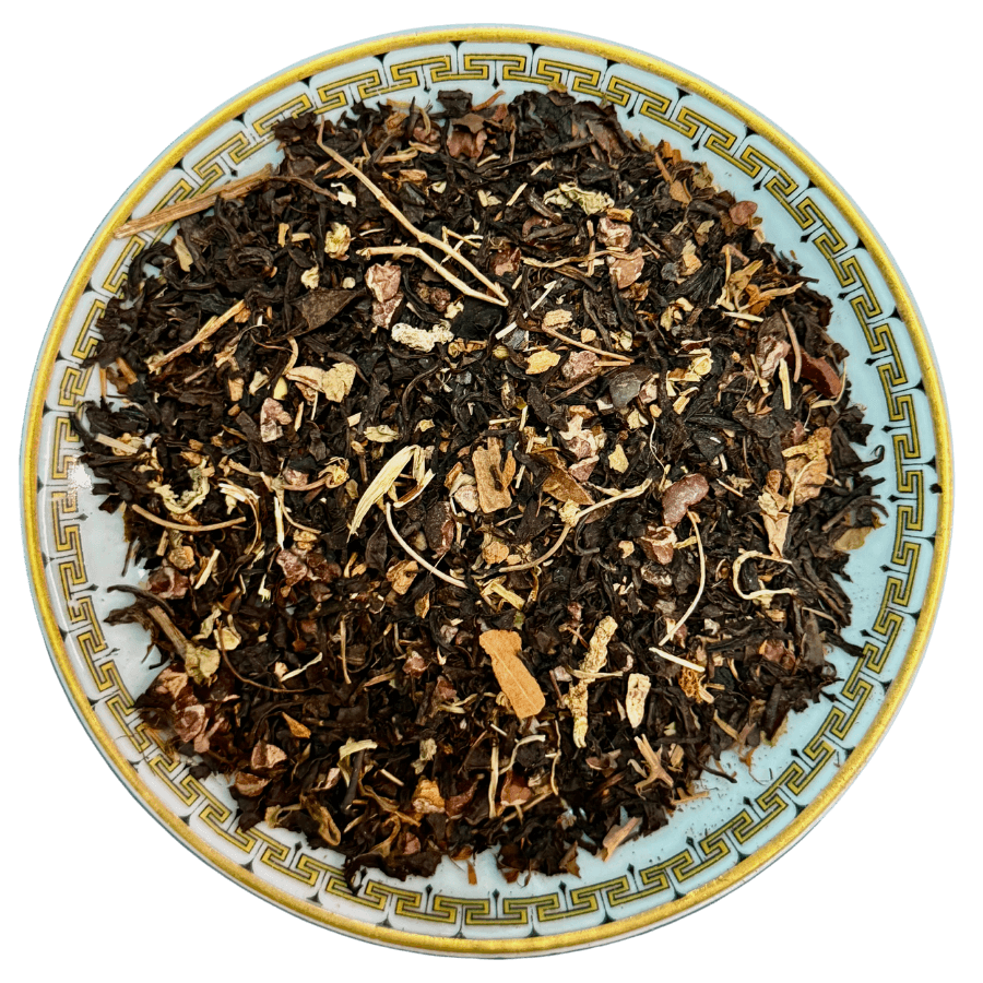Tea leaves on a decorative ceramic plate with intricate patterns