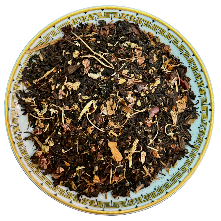 Tea leaves on a decorative ceramic plate with intricate patterns