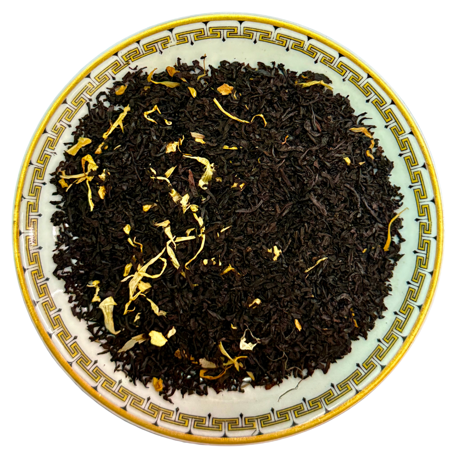 Tea leaves on a decorative plate with a white background