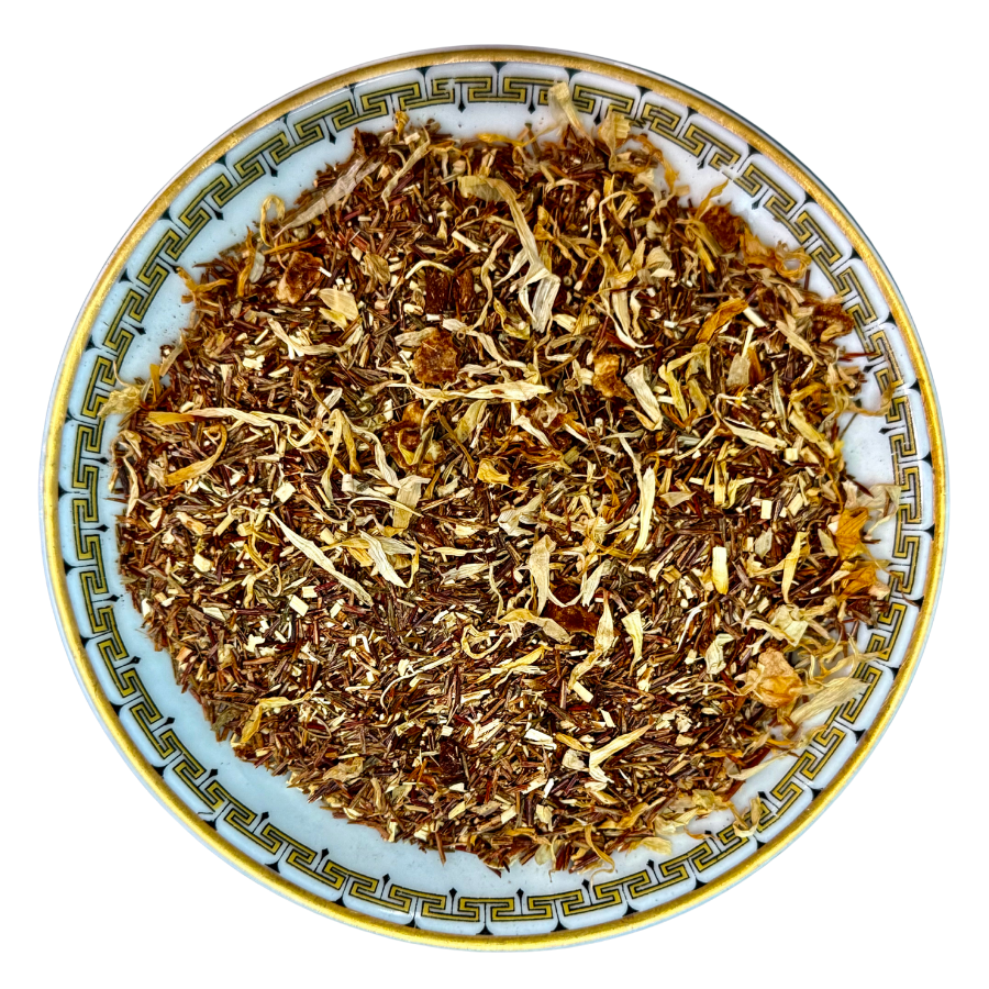 Dry herbs or spices on a decorative ceramic plate with a white background