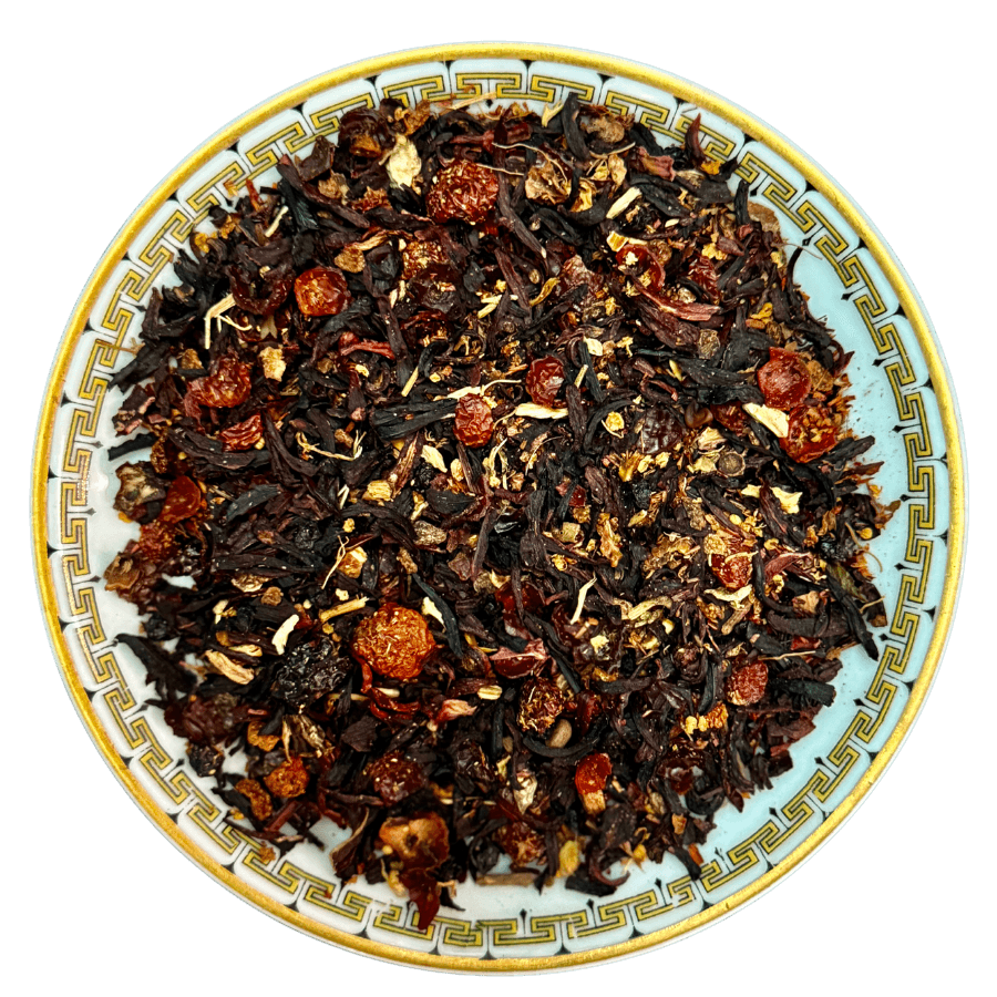 Tea leaves on a decorative plate with a white background