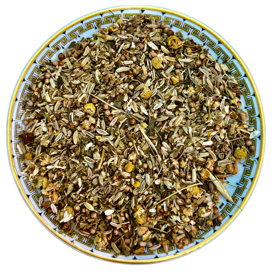 Herbal mix on a decorative plate with a white background