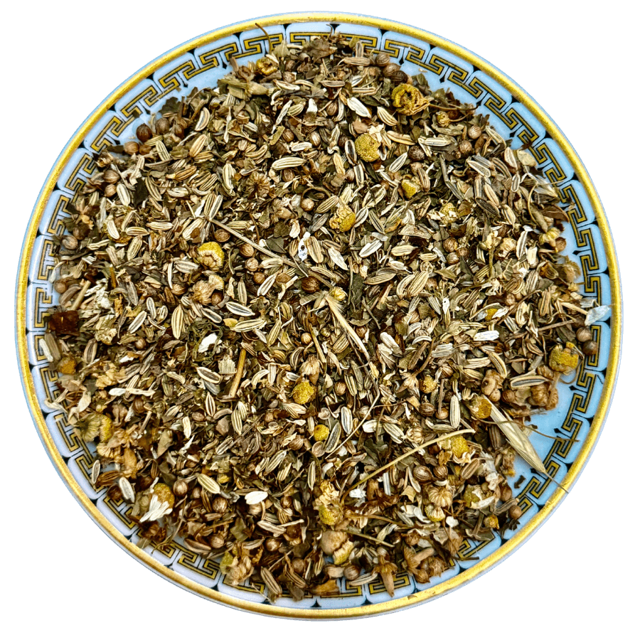 Herbal mix on a decorative plate with a white background