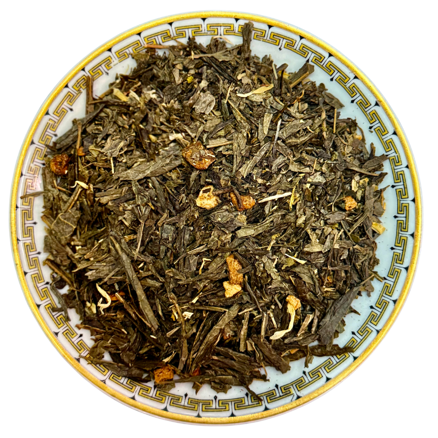 Tea leaves in a decorative bowl on a white background