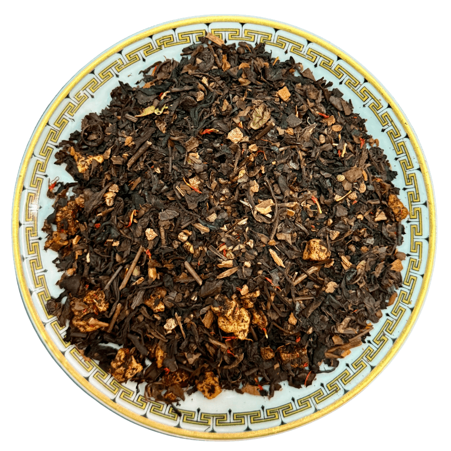Tea leaves on a decorative plate with a white background