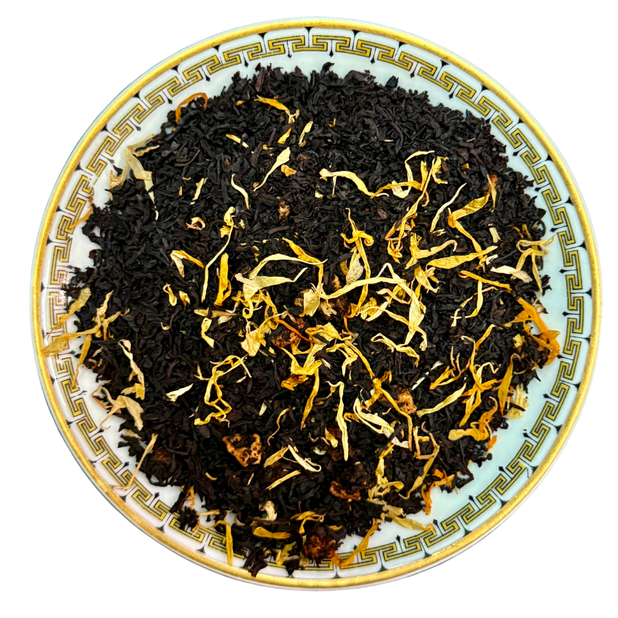 Tea leaves on a decorative plate with a white background