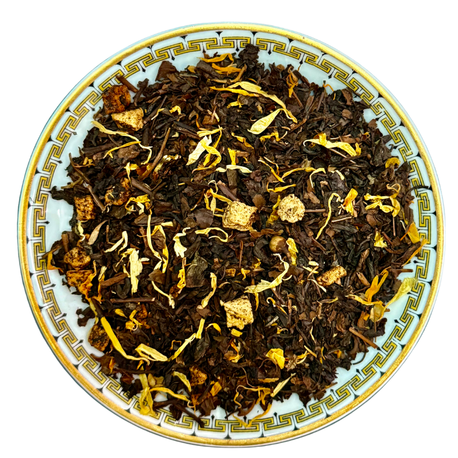 Tea leaves on a decorative plate with a white background