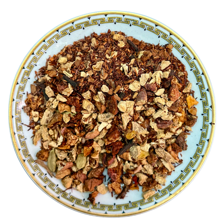 Spice mix on a decorative plate with a white background