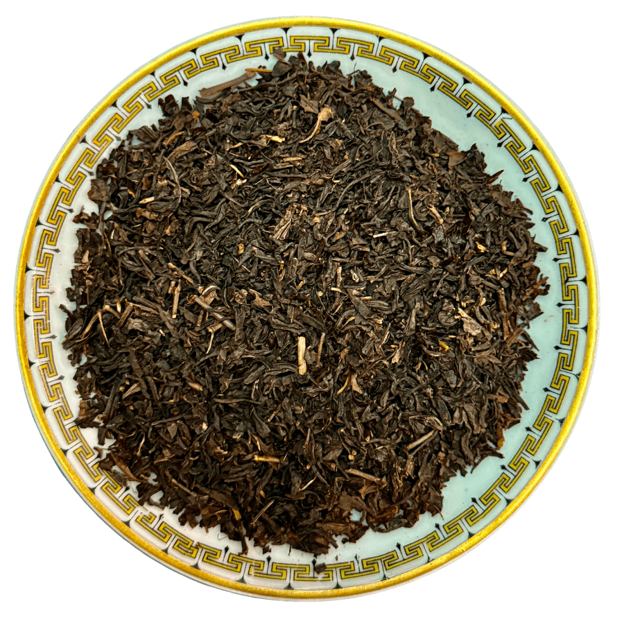 Loose leaf Raspberry Earl Grey De La Creme Tea displayed on a decorative plate.
