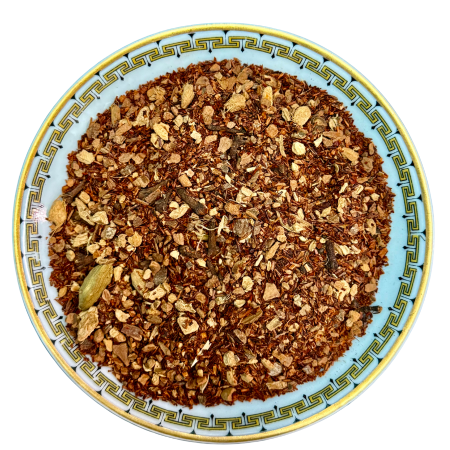 Spice mix on a decorative plate with a white background