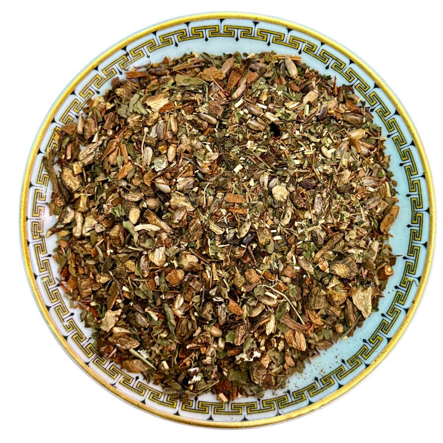 Herbal mix on a decorative plate with a white background