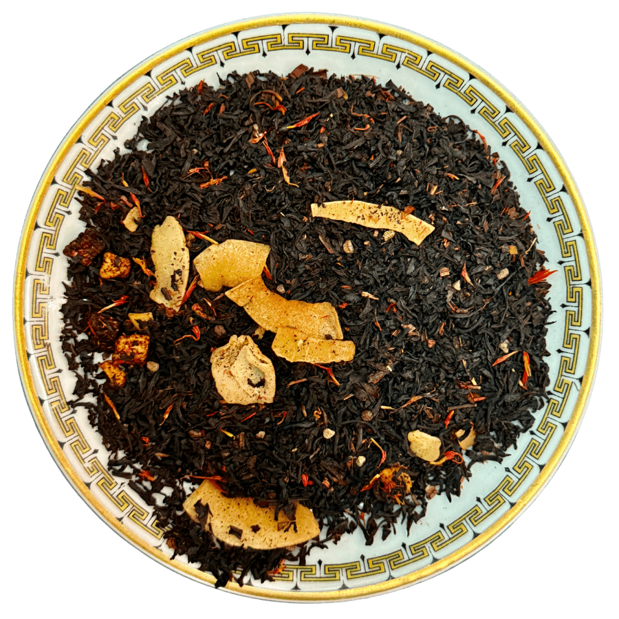 Tea leaves with visible herbs on a decorative plate