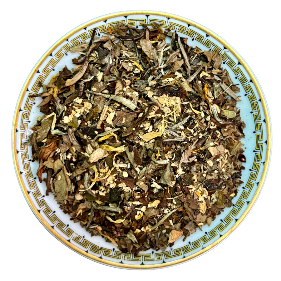 Dry herbs and leaves on a decorative ceramic plate