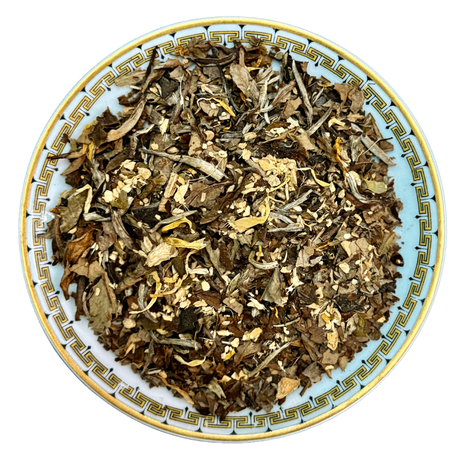 Dry herbs and leaves on a decorative ceramic plate